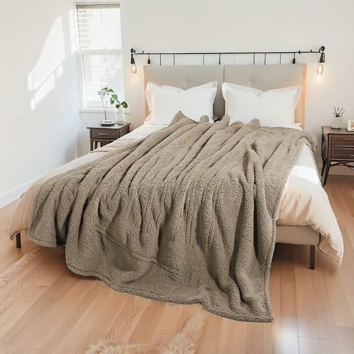 Your Couch Just Got Elevated To "Ultimate Cozy Cave" Status Thanks To An Electric Plush Blanket