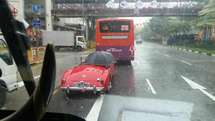 Driving in the Rain While Holding an Umbrella? Yep, That’s a Thing.
