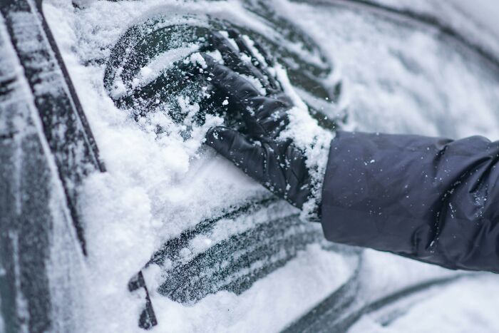 Brushing The Snow Off Her Car