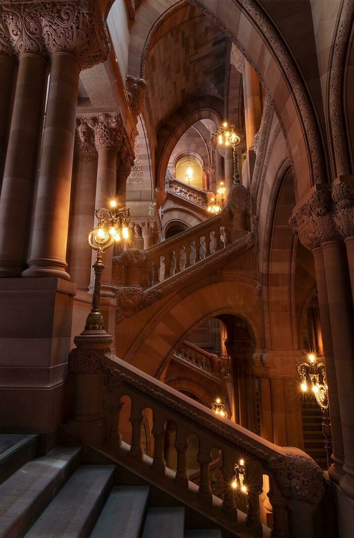 An Insanely Fancy Red Sandstone Staircase: Drama, But Make It Architecture