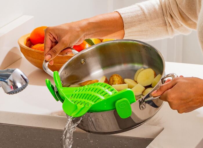 Say Goodbye To Losing Pasta Noodles Down The Drain With This Clip-On Strainer