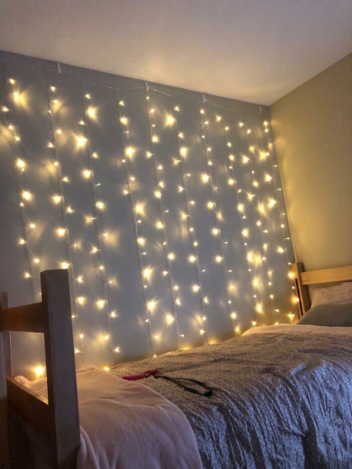 Get Your Bedroom So Cozy You'll Expect A Talking Squirrel To Drop By With These Curtain String Lights
