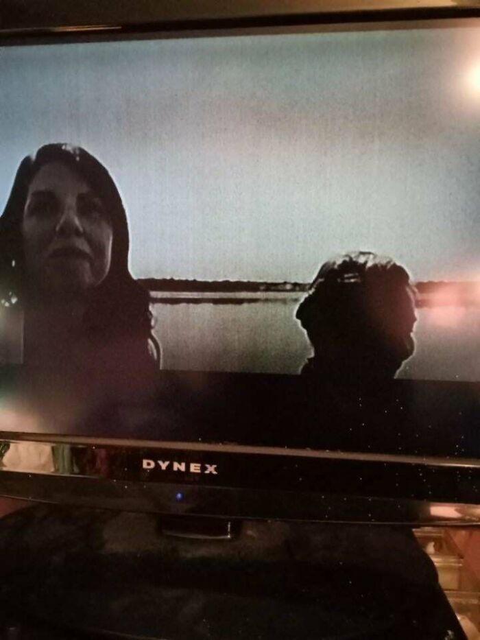 Who Are These Two? TV Turns On By Itself Showing Creepy Stare-Fest