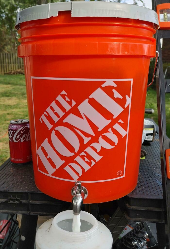 Sealing My New Privacy Fence With a Bucket and a Metal Spigot for Easy Sprayer Refills
