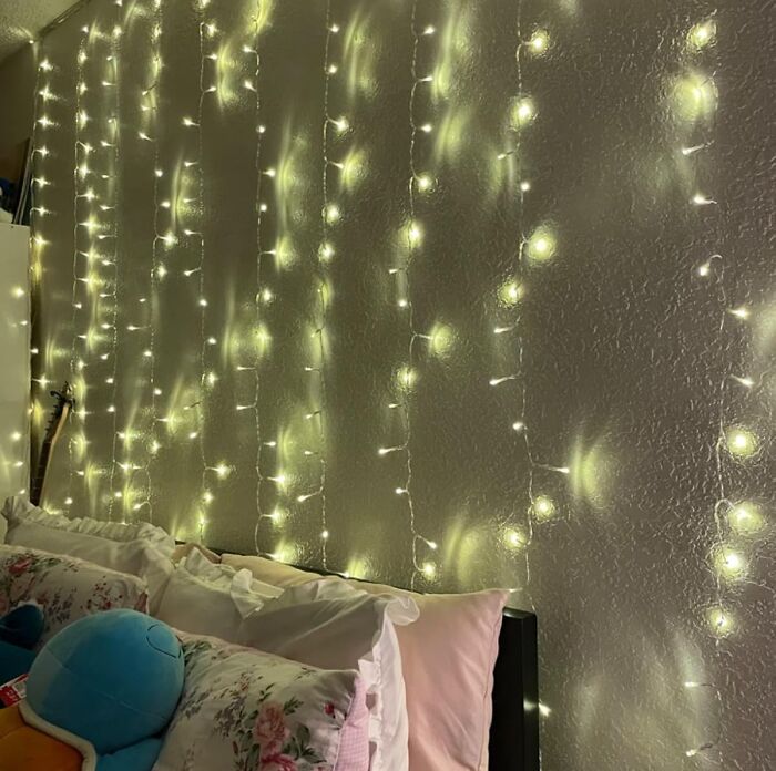 Give That Boring Wall A Fairy-Tale Glow-Up With Curtain Fairy Lights