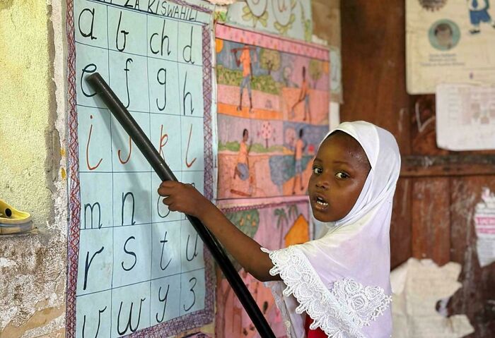 Cute Girl Learning the Alphabet in Zanzibar