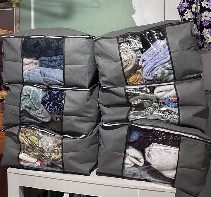 That Mountain Of Stuff On Your Bedroom Chair Can Finally Take A Vacation Thanks To These 90L Storage Bags