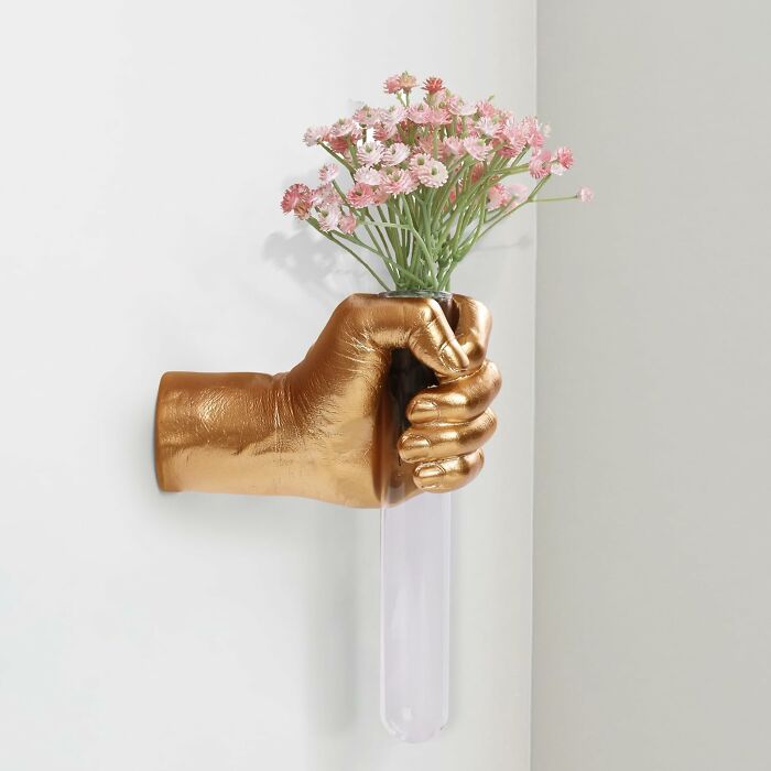 Host Flowers In Style With This Golden Hand Wall Sculpture