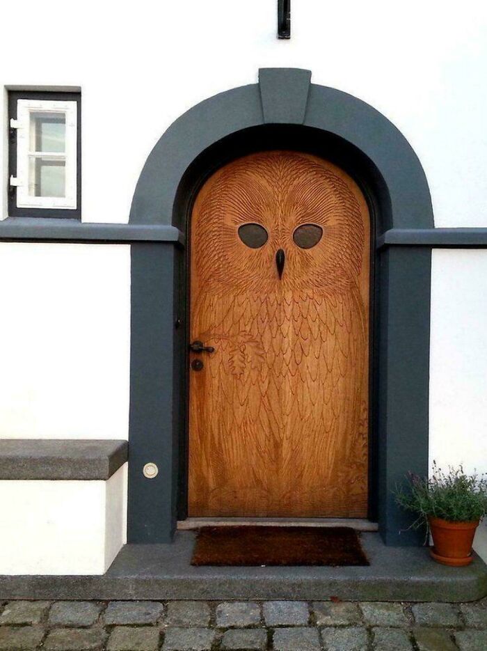 Old-School Wooden Door With Owl Design and Knock Beak in Copenhagen