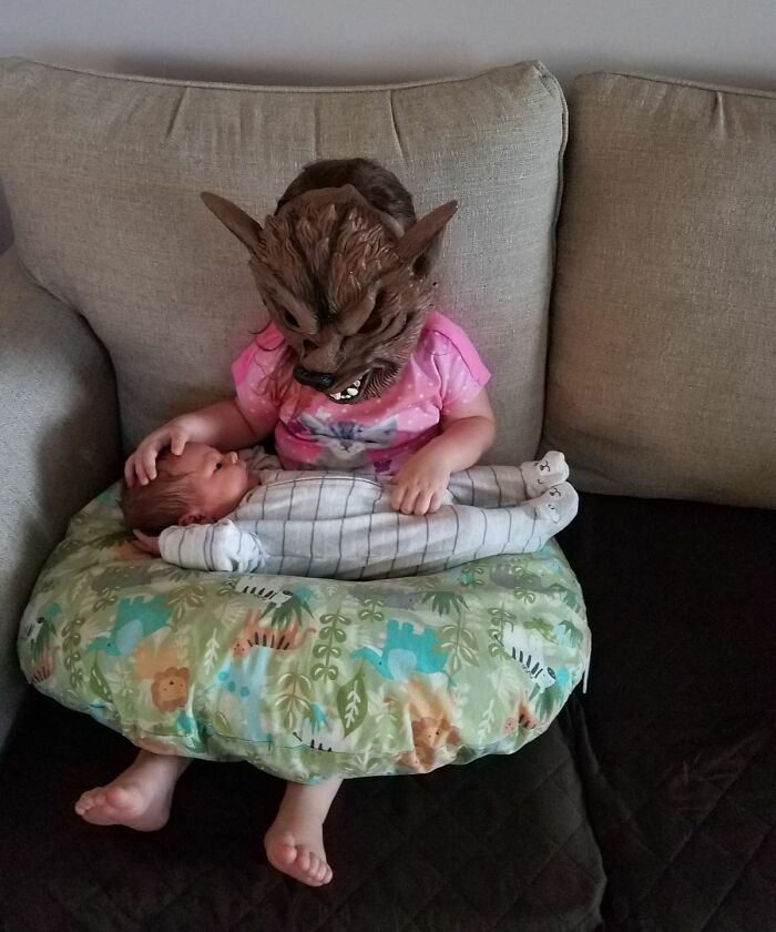 2.5-Year-Old Niece Is Super Serious About How She Holds Her Baby Brother. Like, SUPER serious.