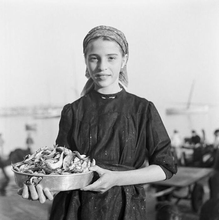 Market Girl Struts Her Stuff by the Seaside in 1940s Netherlands