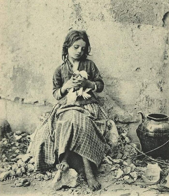 Italian Girl Playing with Bird Barefoot in 1900 Naples