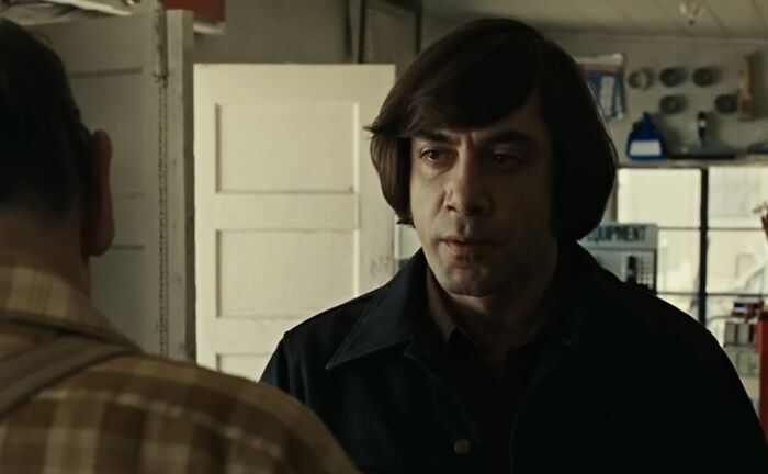 No Country for Old Men (2007) - Anton Chigurh: A hitman with a twisted sense of fairness, leaving life and death up to a coin flip.