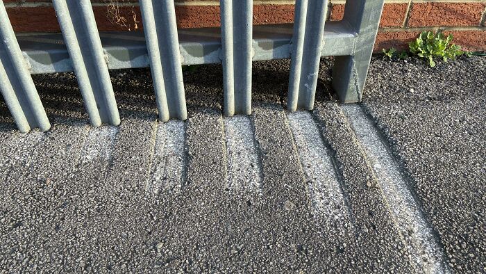 Gate Scraping Concrete Like a DJ Scratchin’ a Record