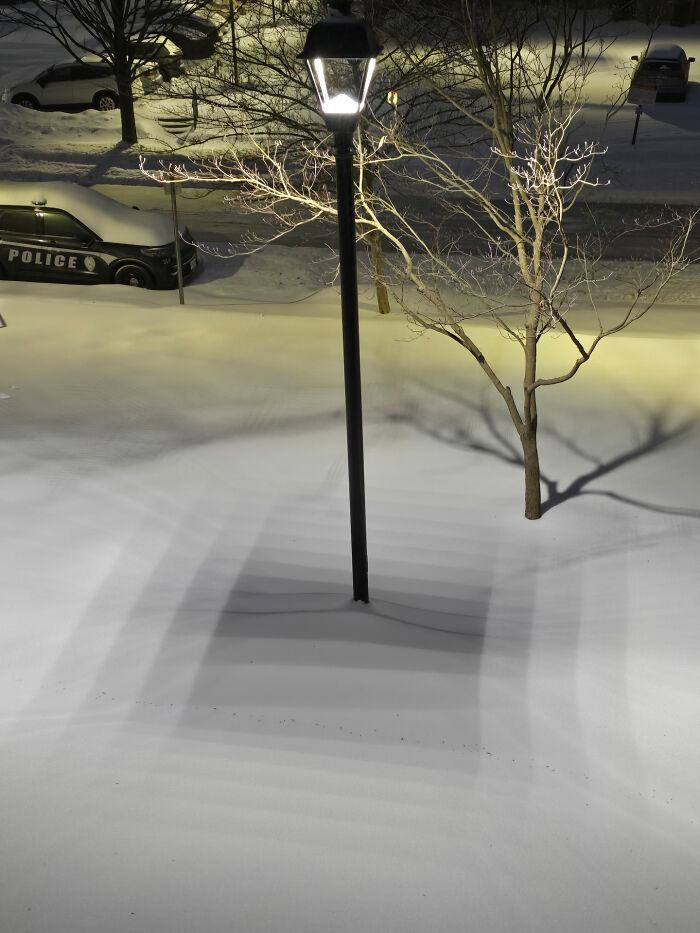 Cool Shadow Drama From An LED Street Lamp On Fresh Snow
