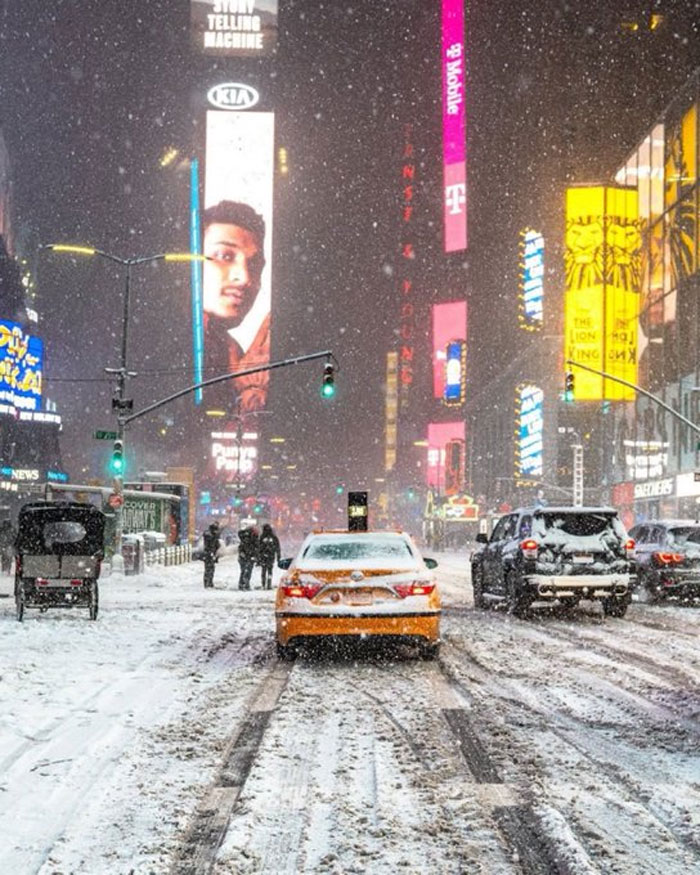 Snowfall Hits Times Square, New York Style