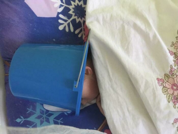 Feeling Sick Kid's 'Barf Bucket' Nap Style