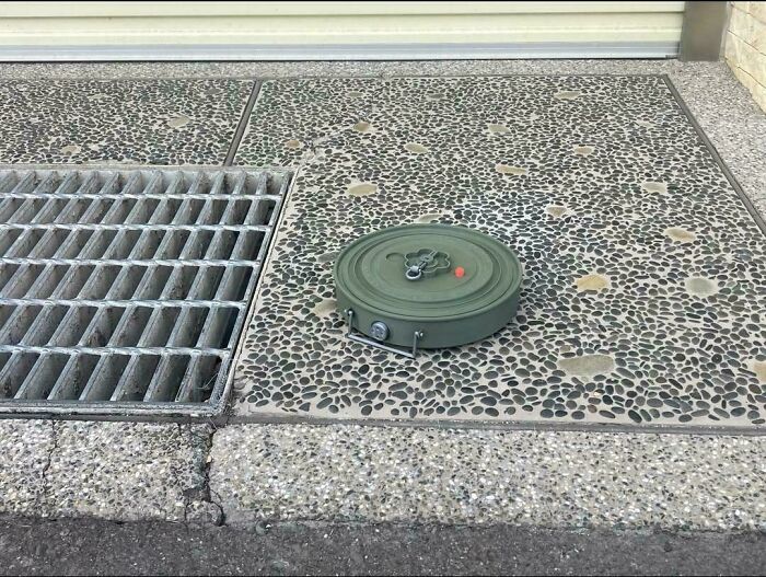 Someone Left A Roomba On The Street. Robot Jail?