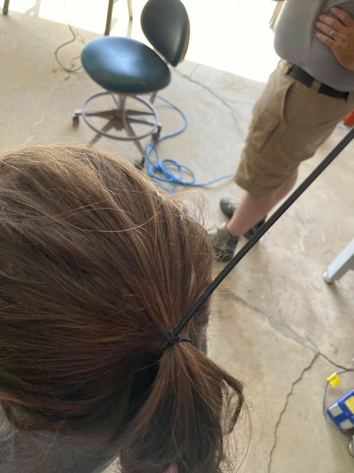 Dad Hack 101: Hair Pulled Back So Daughter Can Work In Garage Safely
