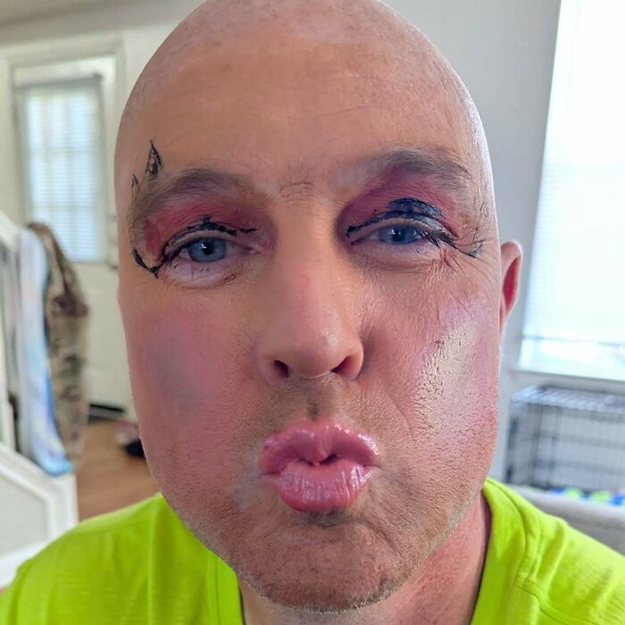 Daughter practicing her makeup skills... on Dad!