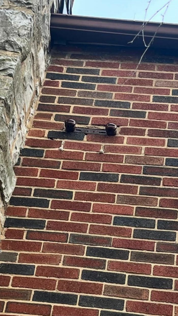 What Are These Electrical Insulators On The Side Of A Brick House?