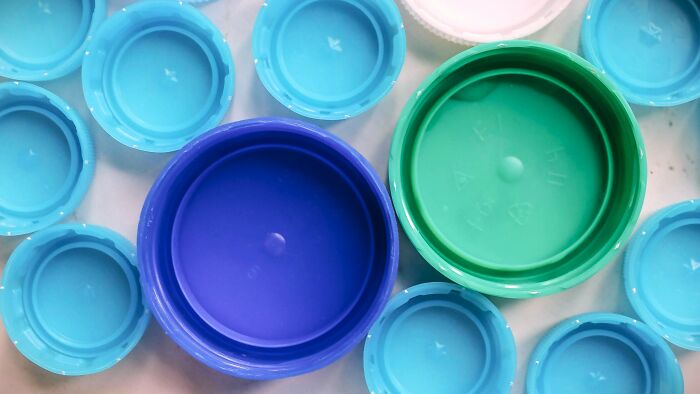 Using a plastic bottle cap as your tiniest, fanciest little drinking glass—posh hydration!