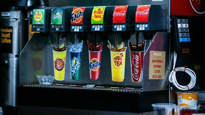 Mixing all the soda machine flavors into one crazy concoction like a sugar scientist in the making.