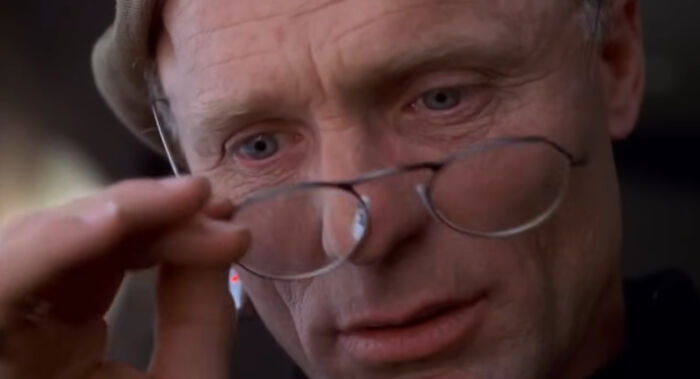 Christof from The Truman Show builds a fake world around Truman to cash in on reality TV—because who needs real life when TV’s streaming 24/7?