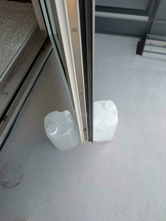Dad’s High-Rise Door Prop? Water-Filled Milk Jugs!