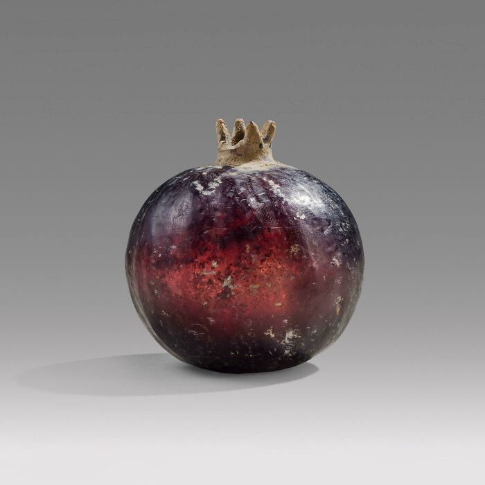 This 2nd Century BCE Greek Pomegranate Vase Glows Burgundy Thanks To Real Gold Tint