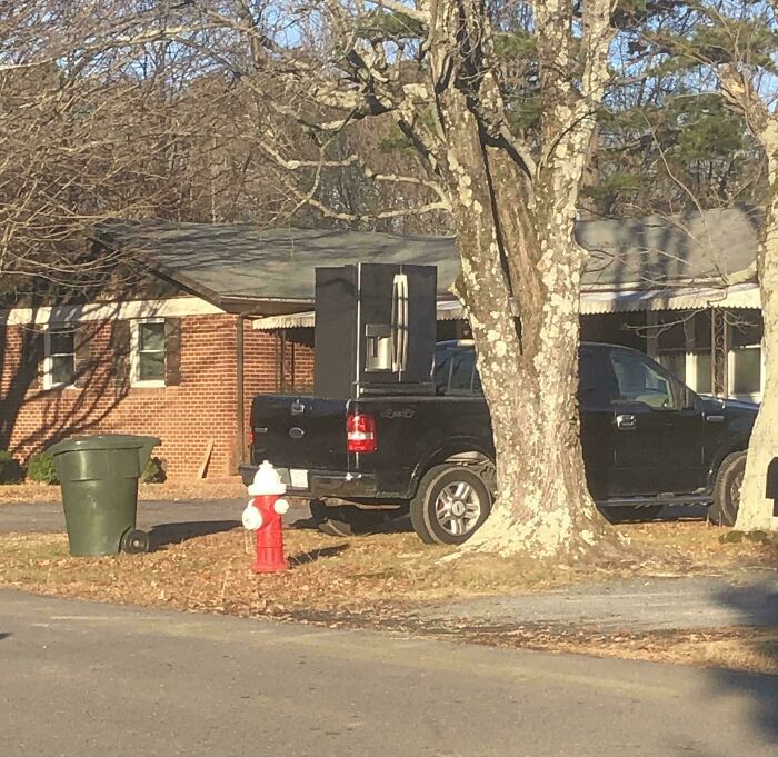 Neighbor Drives Around With A Fridge On His Truck. Everywhere!