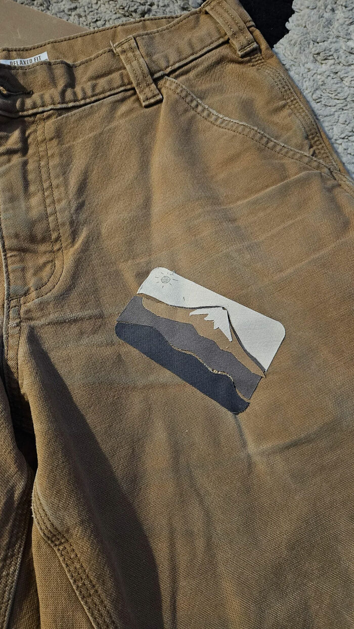 Patched Pants With Iron-On Patches Cut Into a Little Landscape