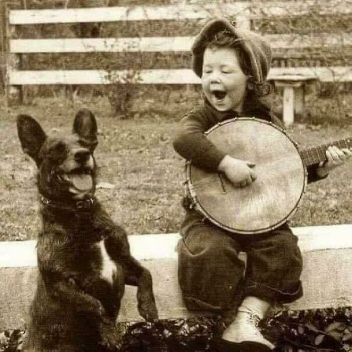 1920 Vibes: Boy Jamming On Banjo With His Dog As Backup