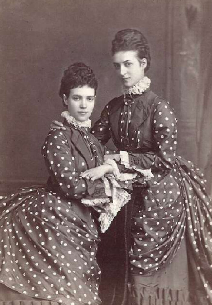 Women In Matching Dotty Dresses With Lace Cuffs, Circa 1875
