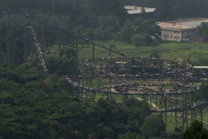 Thousands Climbing North Korea’s Roller Coaster? What’s Going On Here?!