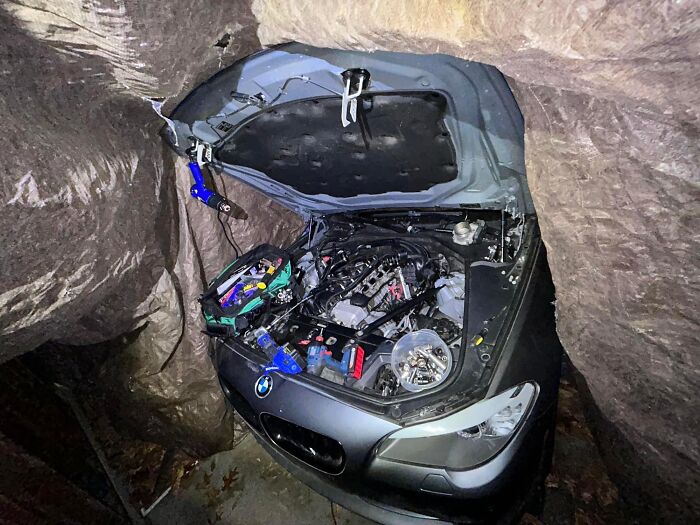 Car Under a Tarp or Rock Between Rocks?