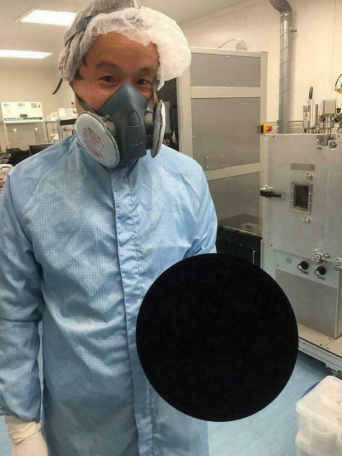 A Scientist Holding A Basketball That’s Literally The Blackest Black Ever