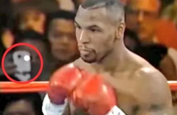 Time Traveler Caught On Camera At 1995 Mike Tyson Fight Using A Smart Device?