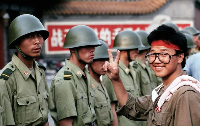 1989 Tiananmen Student Protester Throws Up the Victory Sign in Front of Soldiers