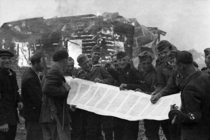 German Soldiers Laugh With a Looted Torah Scroll as the Synagogue Burns, 1941 – Ugly Times