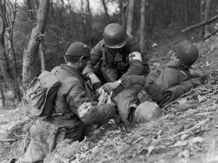 Medics Patching up a Wounded Soldier in Germany, 1944 – Helping Hands