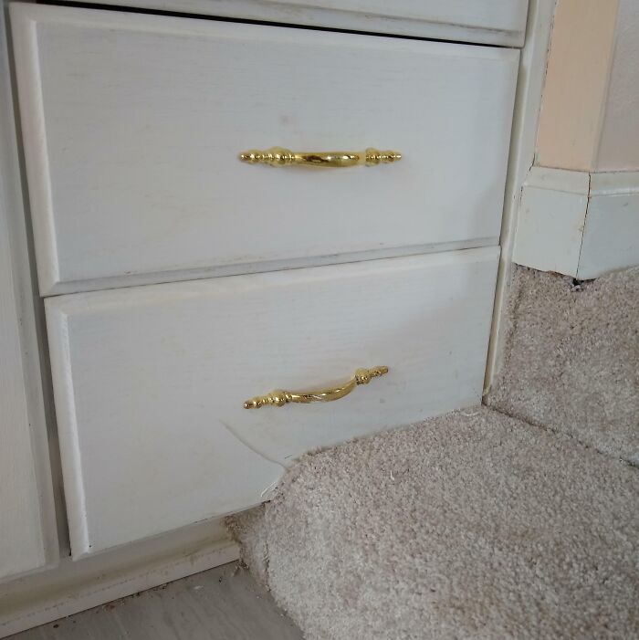 Remodeled Bathroom Has a Carpeted Step Blocking a Vanity Drawer. Yep.