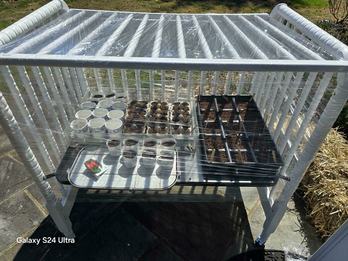Turned an Old Crib Into a Greenhouse on Wheels—Because Why Not?