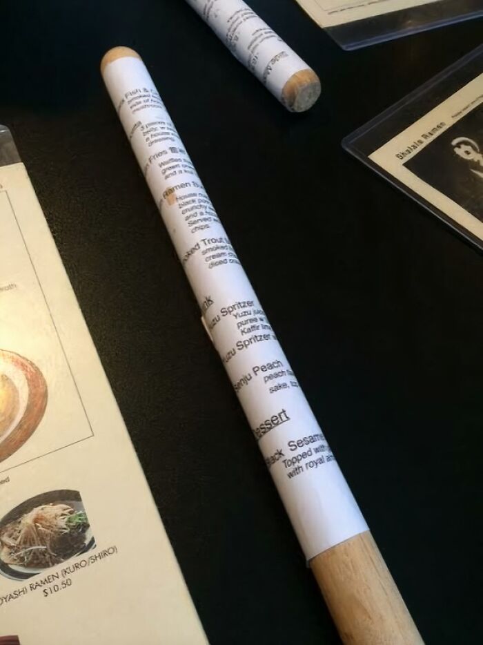 Menu Wrapped Around A Stick. Why? No Idea!
