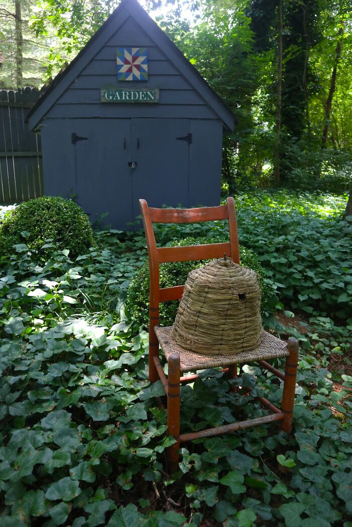 Vintage Bee Skep in an Old Chair in Front of My Garden Shed