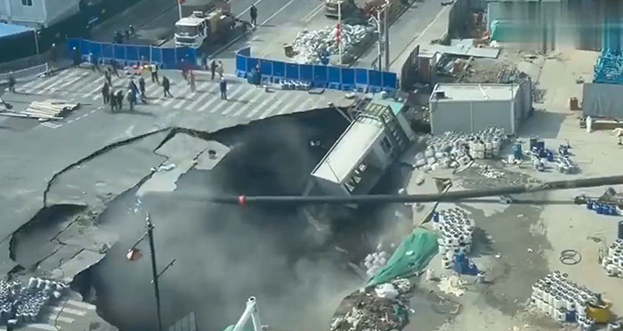 When the Road Disappears: Sinkhole Eats Shanghai’s Busy Street