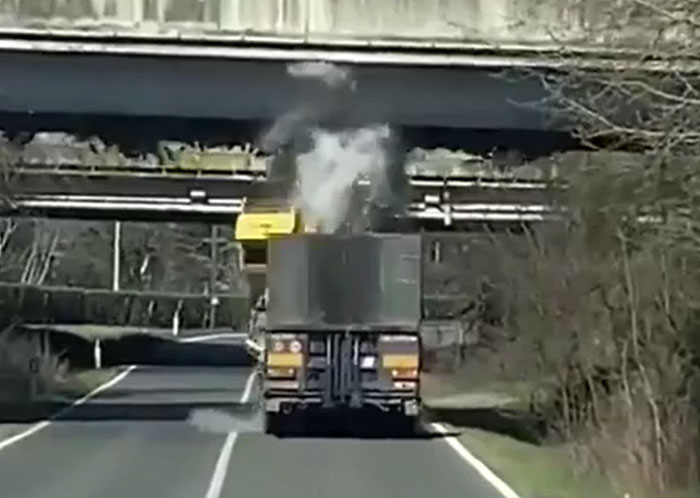 Big Digging Machine Hits an Overpass and Says Uh-Oh