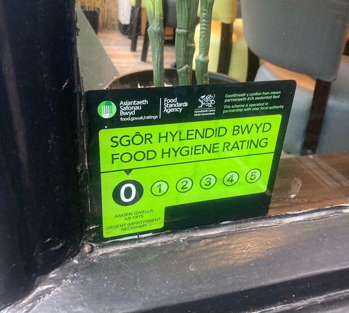 Low-Key Proud Sign At A Restaurant