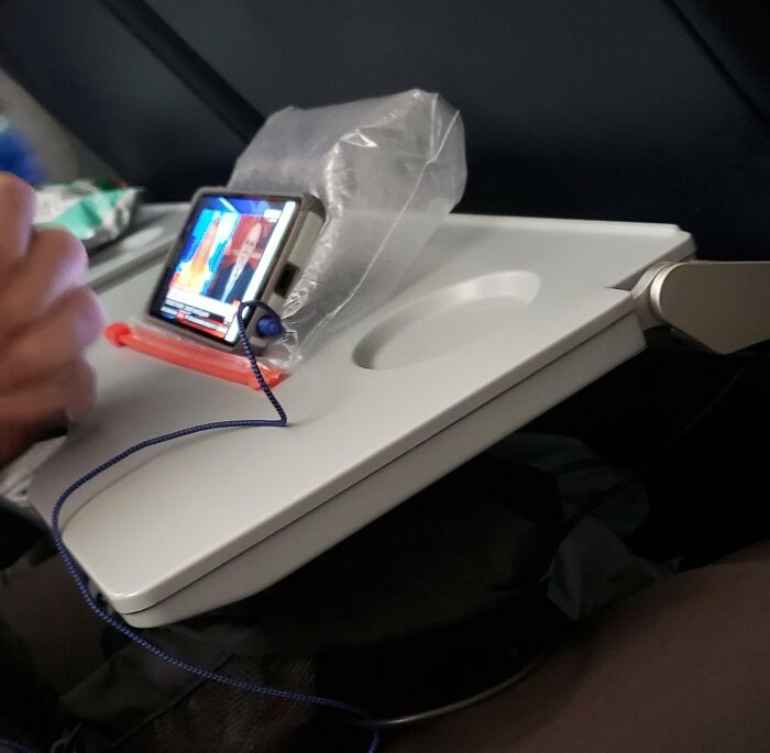 That Flight Seat Neighbor Level: Ingenious Phone Stand
