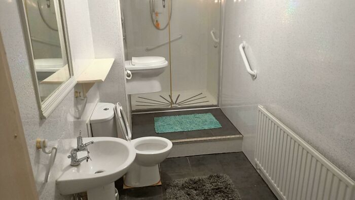 Bathroom With Two Toilets, and One’s Halfway Up the Wall?